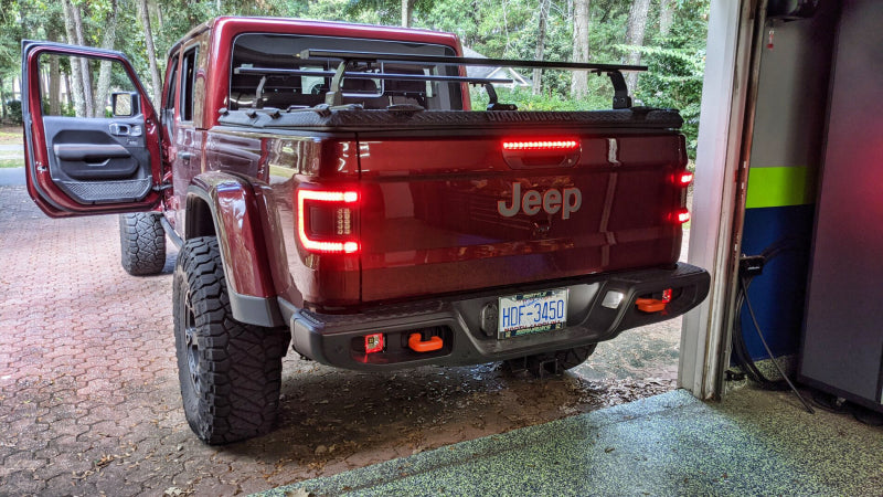 Jeep Gladiator JT flaunting ORACLE Lighting Flush Mount LED Tail Lights, offering enhanced visibility and style.