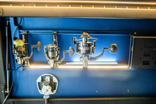 Load image into Gallery viewer, Dirtbox Overland Fishing Reel Mount showcasing three fishing reels secured on the inside of a canopy door, providing optimal accessibility and organization for fishing gear during overland adventures.