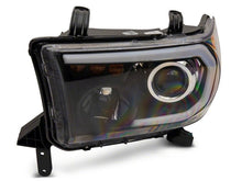 Load image into Gallery viewer, Raxiom 07-13 Toyota Tundra Axial Series Projector Headlights w/ LED Bar- Blk Housing (Clear Lens)