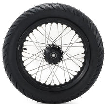 Load image into Gallery viewer, Rear view of a robust 14 inch Supermoto wheel by Puget Sound Motorsports, featuring a black tire and intricate spoke design.