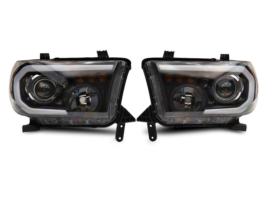 Raxiom 07-13 Toyota Tundra Axial Projector Headlights w/ SEQL LED Bar- Black Housing (Clear Lens)