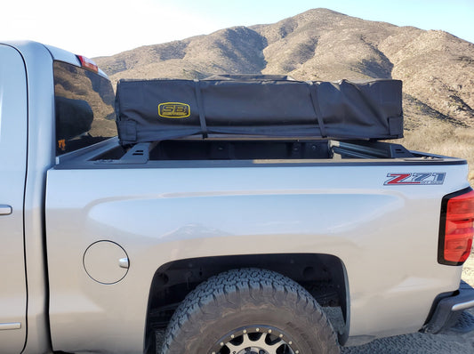 2014-2018 Silverado/Sierra 1500 Bed Rack by Range Industries, showcasing a rooftop tent securely mounted on the truck bed.