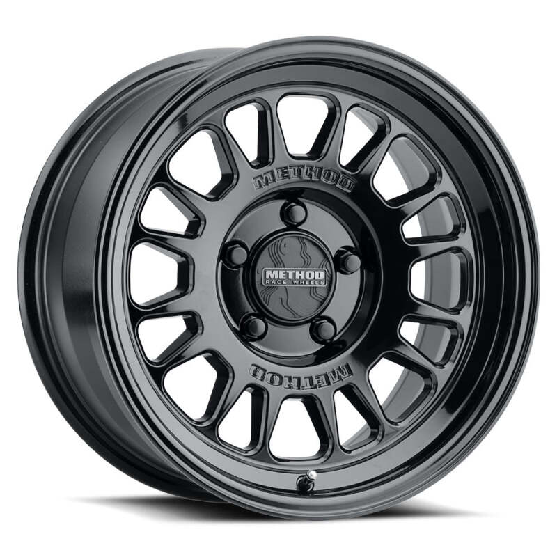 Method Wheels MR318 18x9 wheel in gloss black finish with an 8x180 lug pattern and +18mm offset, showcasing a stylish and rugged design perfect for light trucks.