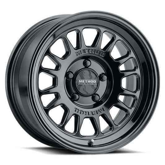 Method Wheels MR318 18x9 wheel in gloss black finish with an 8x180 lug pattern and +18mm offset, showcasing a stylish and rugged design perfect for light trucks.