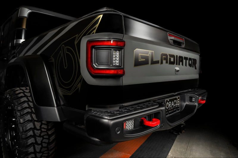 Jeep Gladiator JT featuring ORACLE Lighting Flush Mount LED Tail Lights, demonstrating stylish and bright illumination.
