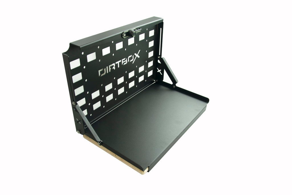 Open view of the DirtBox Overland Folding Camp Table with Cutting Board & Side MOLLE Box, demonstrating its practical use for outdoor activities.