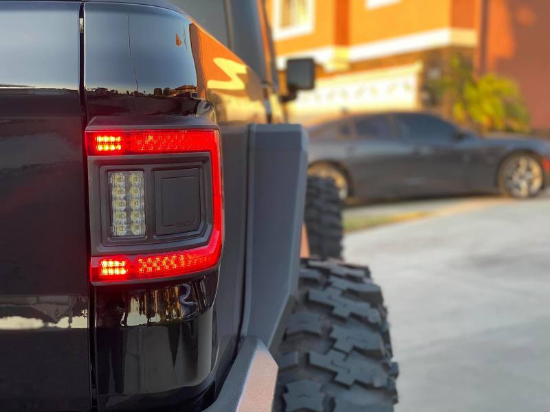 Rear view of Jeep Gladiator JT with ORACLE Lighting Flush Mount LED Tail Lights, highlighting safety and style.