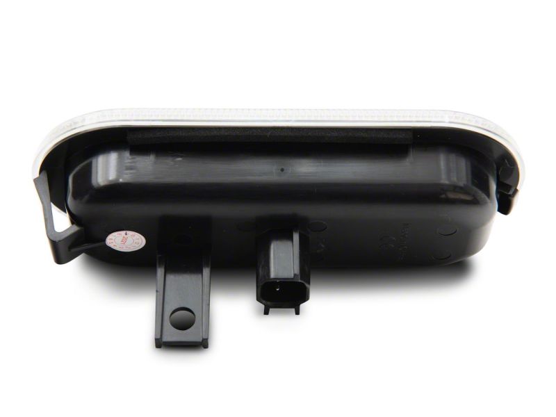 Raxiom Axial Series LED Cargo Light for 2015-2023 Ford F-150 and 2017-2023 Ford F-250/F-350 Super Duty, showcasing its compact design and connector.