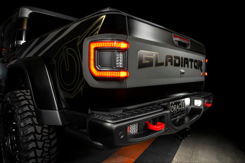 Dynamic view of Jeep Gladiator JT with ORACLE Lighting Flush Mount LED Tail Lights lit up, enhancing rear visibility.