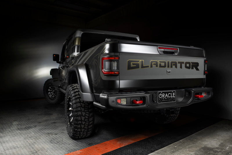 Rear view of a Jeep Gladiator JT showcasing ORACLE Lighting's Flush Mount LED Tail Lights, emphasizing modern design.
