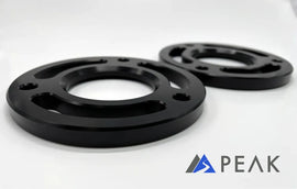 Close-up of PEAK Suspension Silverado ZR2 Leveling Kit spacers highlighting the sleek black finish, crafted for a perfect fit and improved stance on 2019 and newer Chevy Silverado models.