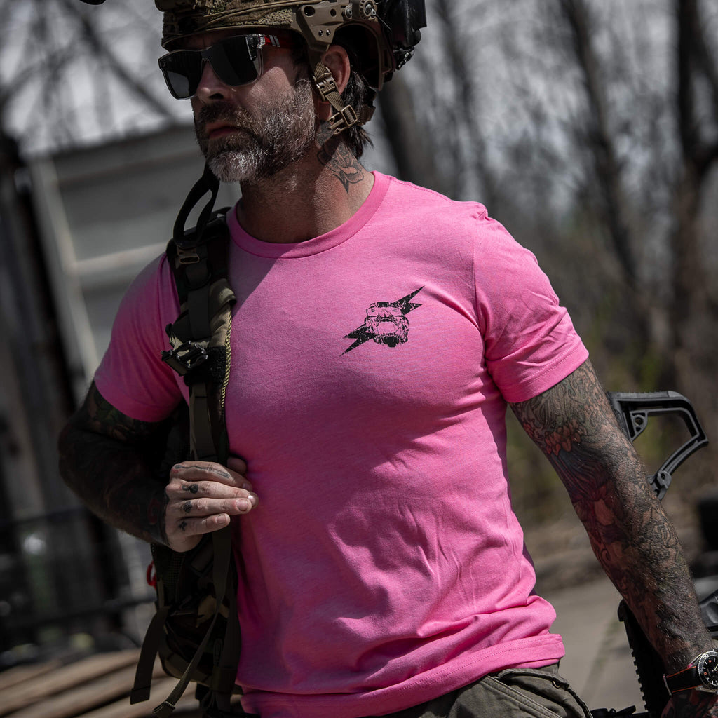 Front view of a pink t-shirt with 'Scars Remind You That You're Alive' logo by Combat Iron Apparel.