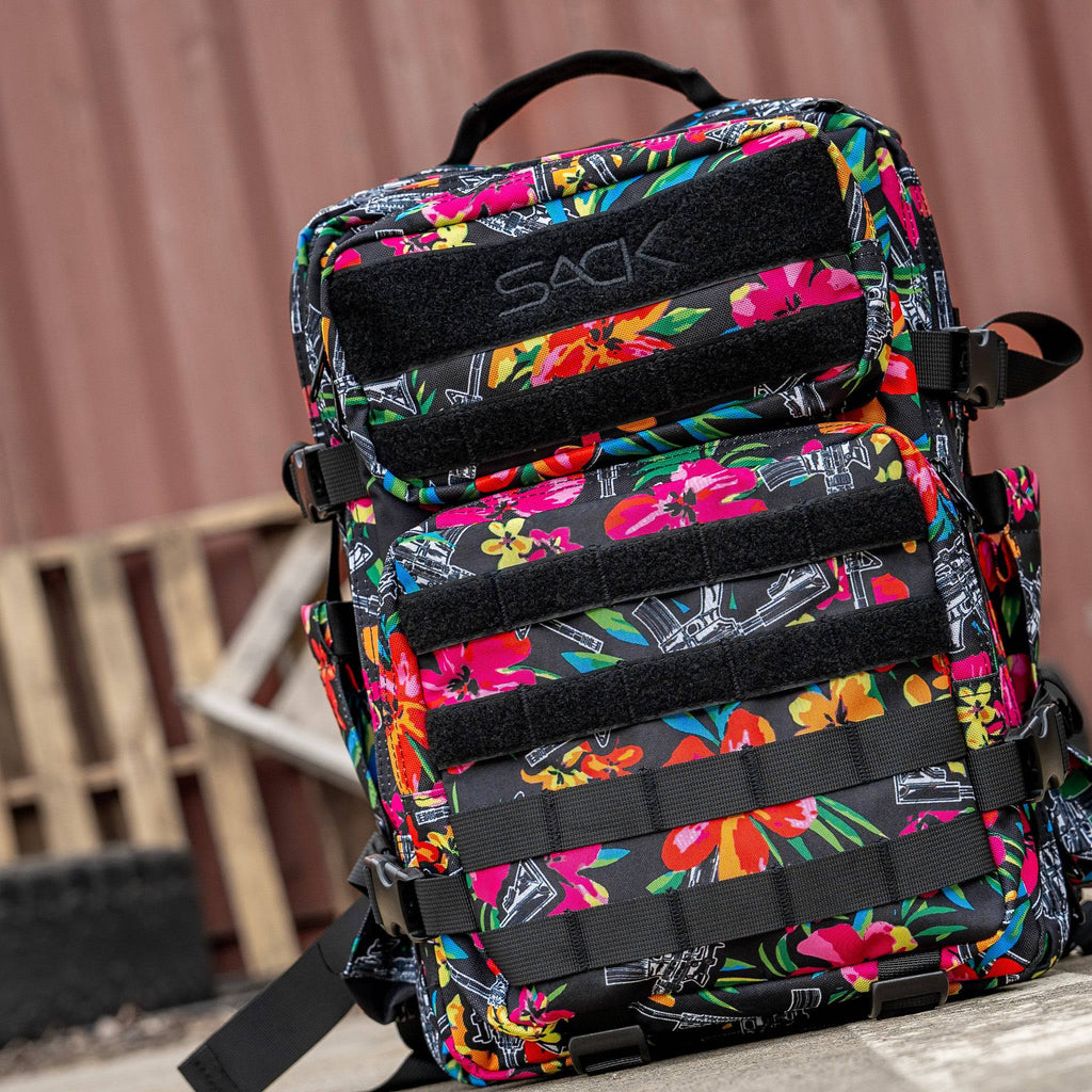 Close-up of Combat Iron Apparel 25L Sack™ Original All-Day Molle Backpack with Pouch, emphasizing the fun floral pattern.