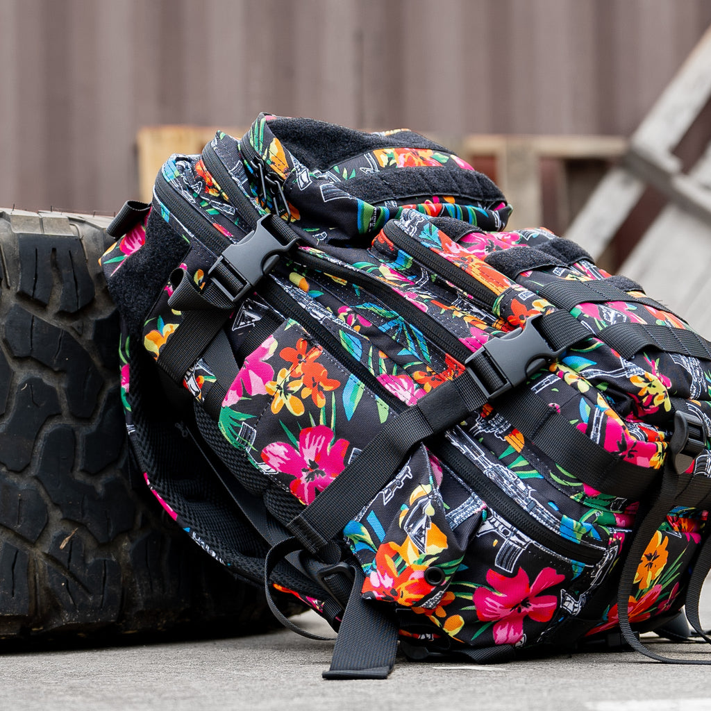 Side view of the Combat Iron Apparel 25L Sack™ Original All-Day Molle Backpack with Pouch, fully loaded with outdoor gear.