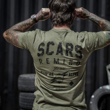 Load image into Gallery viewer, Back view of an olive green t-shirt featuring the text 'Scars Remind You That You're Alive' by Combat Iron Apparel.