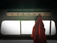 Load image into Gallery viewer, Inner Storage accessory from Dirtbox Overland featuring a clothing hanger with a red jacket hanging, designed for organized vehicle interiors.