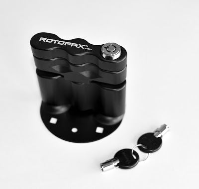 LOX Pack Mount by RotopaX featuring a sleek black design with a key cylinder and lock for security.