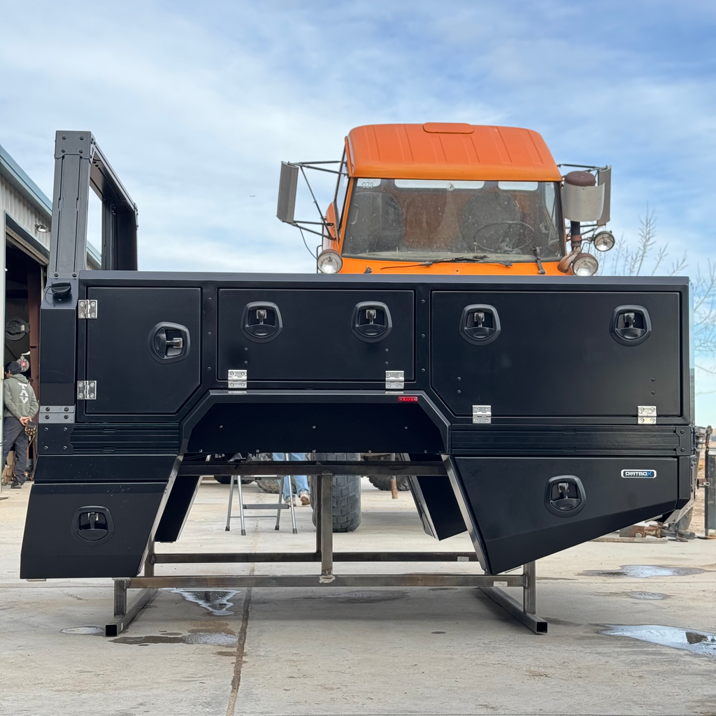 Transformer Drop Center Flatbed by DirtBox Overland, featuring a robust structure and convenient storage options, perfect for overland and camper setups.