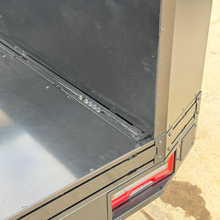 Load image into Gallery viewer, Rear view of the Transformer Drop Center Flatbed by Dirtbox Overland, emphasizing the connector area and robust design, perfect for overland adventures.