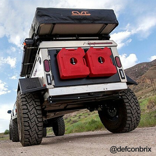 3 Gallon Gasoline containers by RotopaX mounted on the back of an off-road vehicle, showcasing rugged outdoor storage.