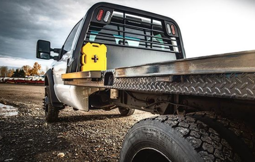 2 Gallon Diesel fuel container by RotopaX secured on the side of a pickup truck, highlighting its practical use for outdoor adventures.