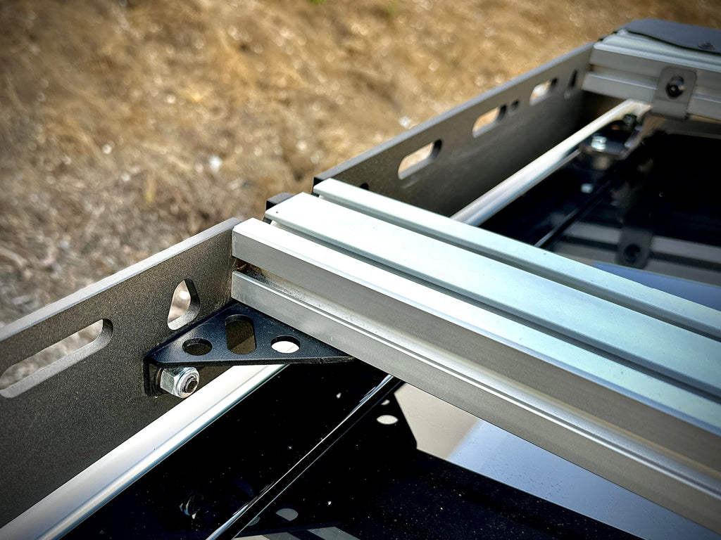 Close-up of the connection point on the 'Laguna' roof rack for Rivian R1T by Range Industries, demonstrating its solid construction and ease of assembly.