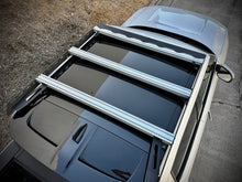 Load image into Gallery viewer, Top view of the 'Laguna' Rivian R1T compatible roof rack by Range Industries, showcasing its sleek design and sturdy crossbars.
