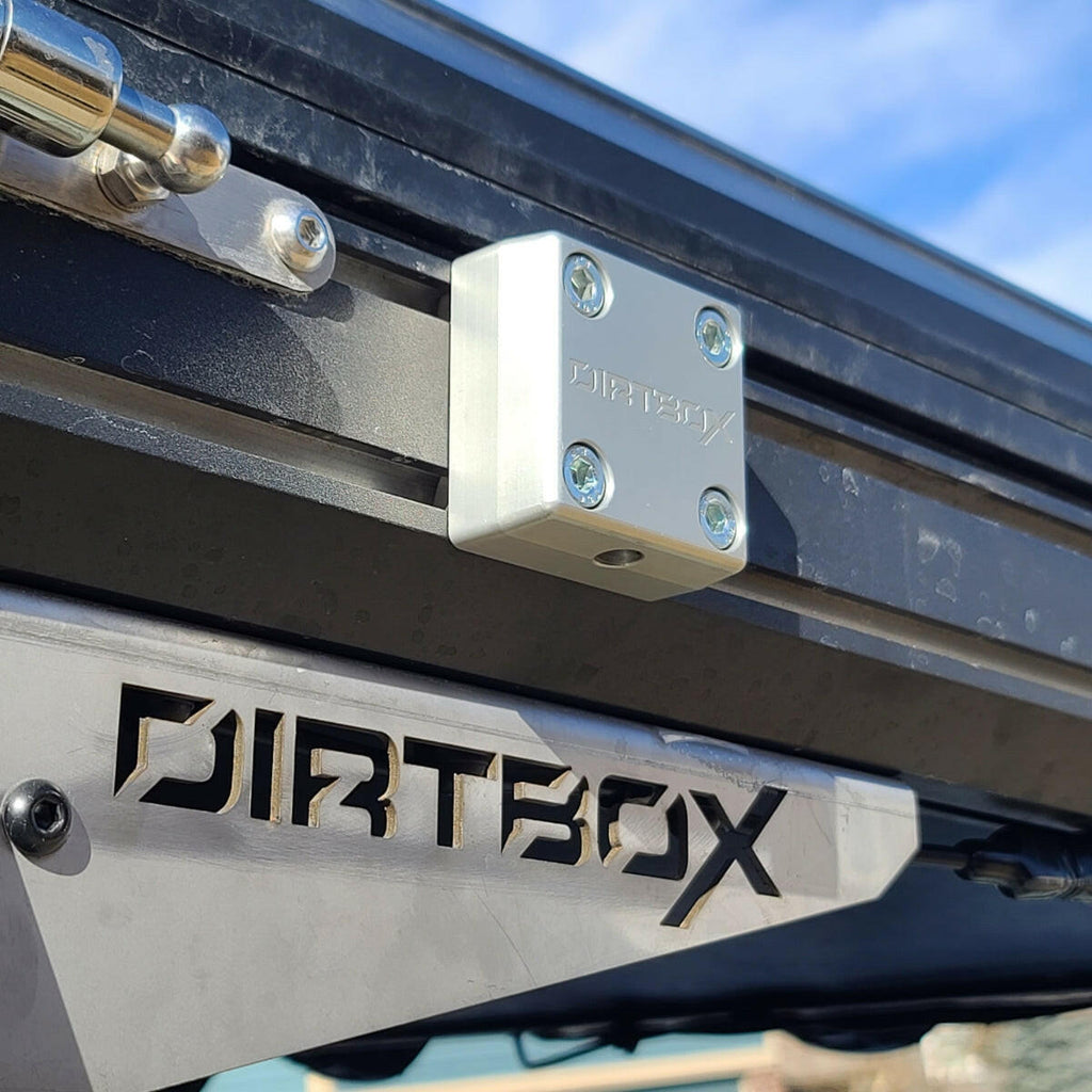 Close-up of The Chunk Quick Release Bracket by Dirtbox Overland mounted, showcasing its robust design and precision engineering.
