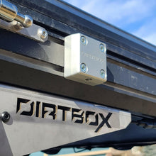 Load image into Gallery viewer, Close-up of The Chunk Quick Release Bracket by Dirtbox Overland mounted, showcasing its robust design and precision engineering.