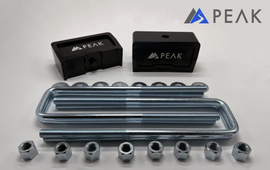 Peak Suspension Silverado ZR2 1 inch lift block kit including lift blocks and U-bolts for easy installation.