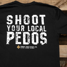 Load image into Gallery viewer, A man lifting weights while wearing a black t-shirt that says 'Shoot Your Local Pedos', designed by Combat Iron Apparel.