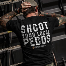 Load image into Gallery viewer, Dynamic pose of a man lifting weights in a black t-shirt that says 'Shoot Your Local Pedos' on the back, from Combat Iron Apparel.