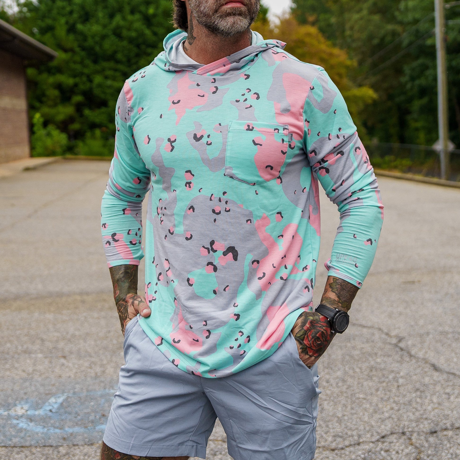 Sneak peek at the back of the Men's Outdoors Long Sleeve Performance Hoodie by Combat Iron Apparel with a camo design.