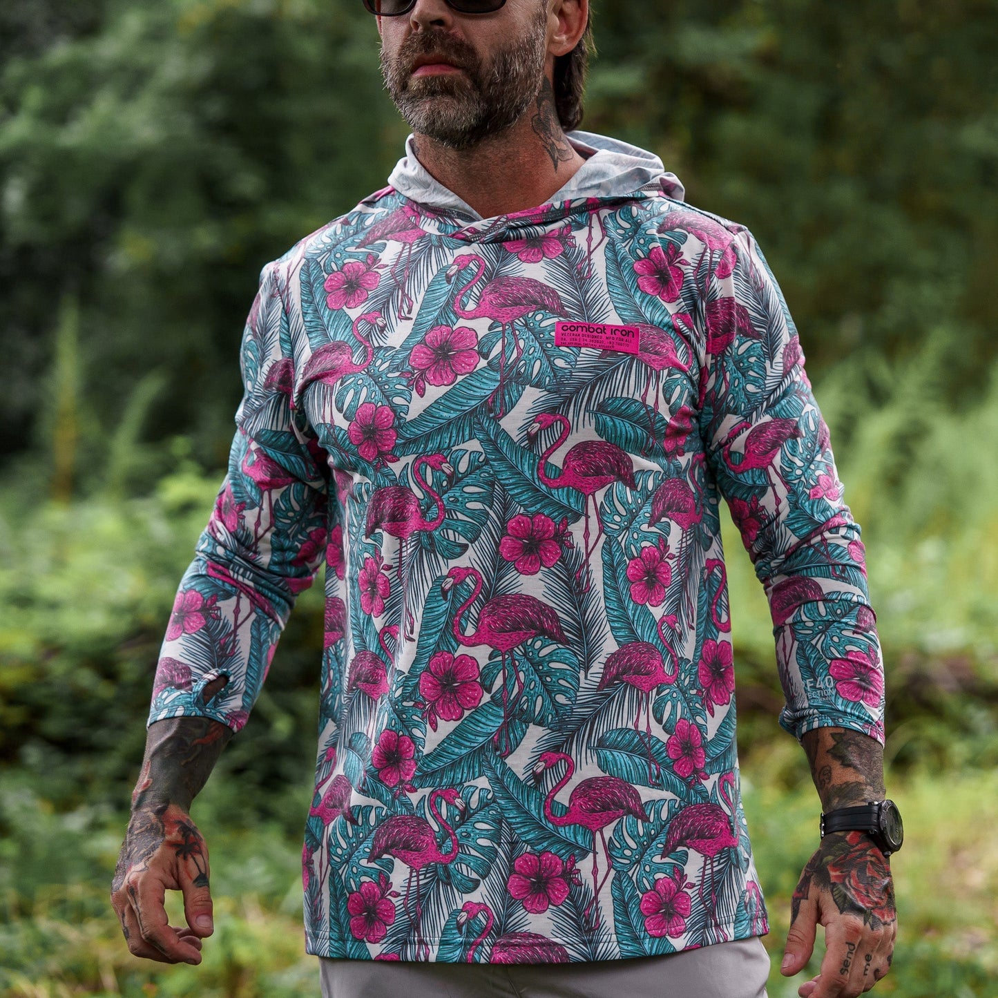 Men's Outdoors Long Sleeve Performance Hoodie by Combat Iron Apparel, shown in detail with hood up against nature.