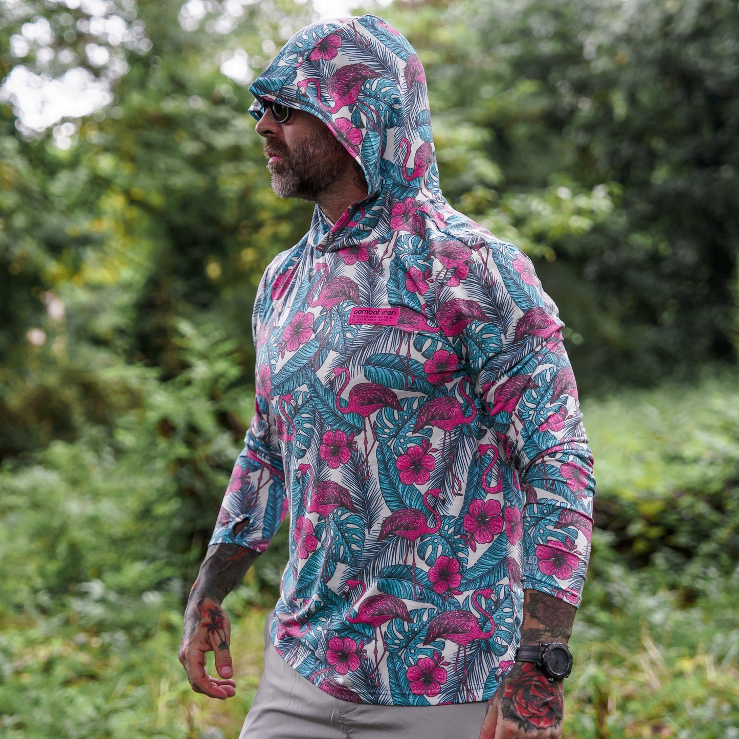 Men's Outdoors Long Sleeve Performance Hoodie displayed in detail to showcase vibrant tribal patterns by Combat Iron Apparel.