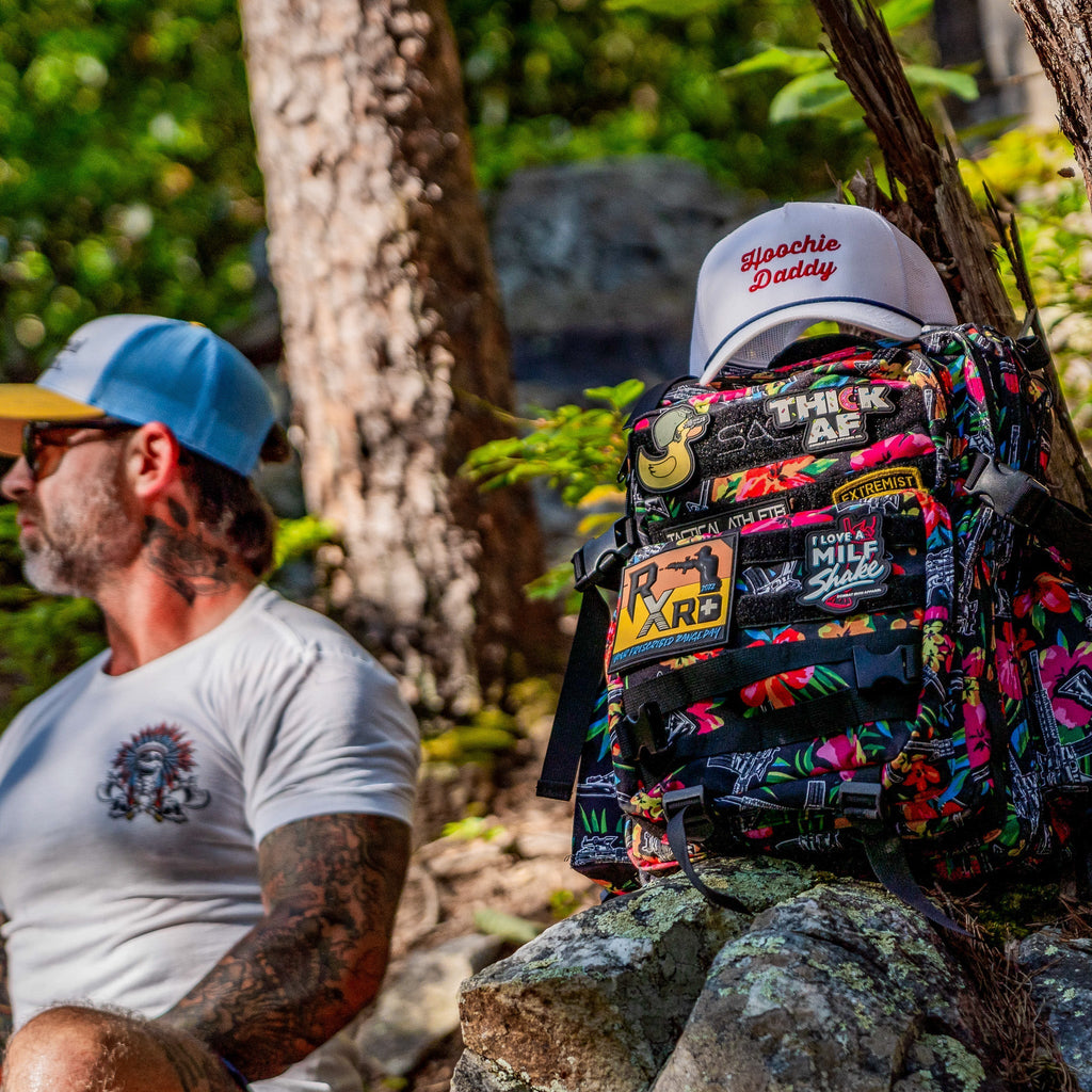 A well-structured Combat Iron Apparel 25L Sack™ Original All-Day Molle Backpack with Pouch against a stylish background.