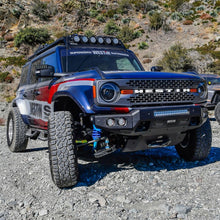 Load image into Gallery viewer, Close-up view of a Ford Bronco featuring the Superwinch Hidden Winch Mount, highlighting its rugged design and advanced winching features.