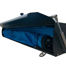 Open hard case of the Dirtbox Overland Hard Case Shower/Bathroom Awning revealing the compact blue fabric inside, highlighting the practical storage features.
