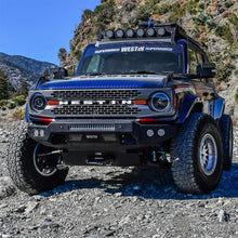 Load image into Gallery viewer, Front angle of a Ford Bronco fitted with Superwinch Hidden Winch Mount, emphasizing its robust construction and stylish appearance.