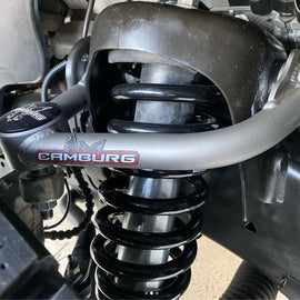 Close-up view of Camburg Performance Uniball Upper Arms installed on a Ford F-150, showcasing the 1.25-inch uniball bearings designed for enhanced performance.