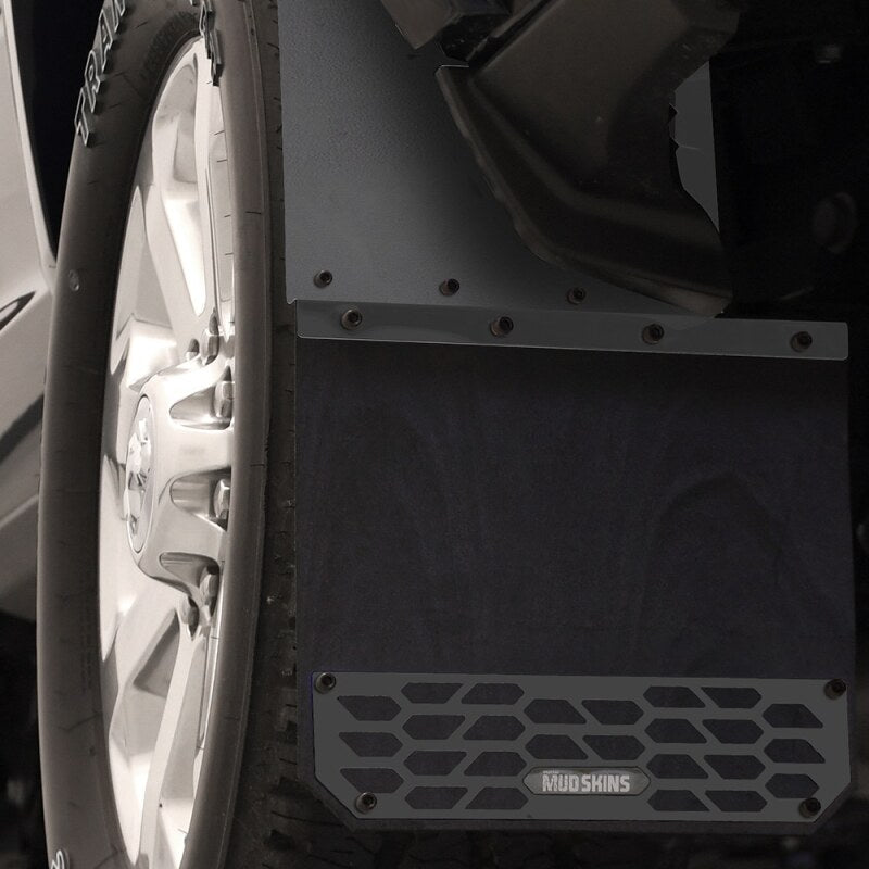 Stylish installation of Putco 10-24 Ram HD Mud Skins showcasing their sleek hex shield design on a truck.