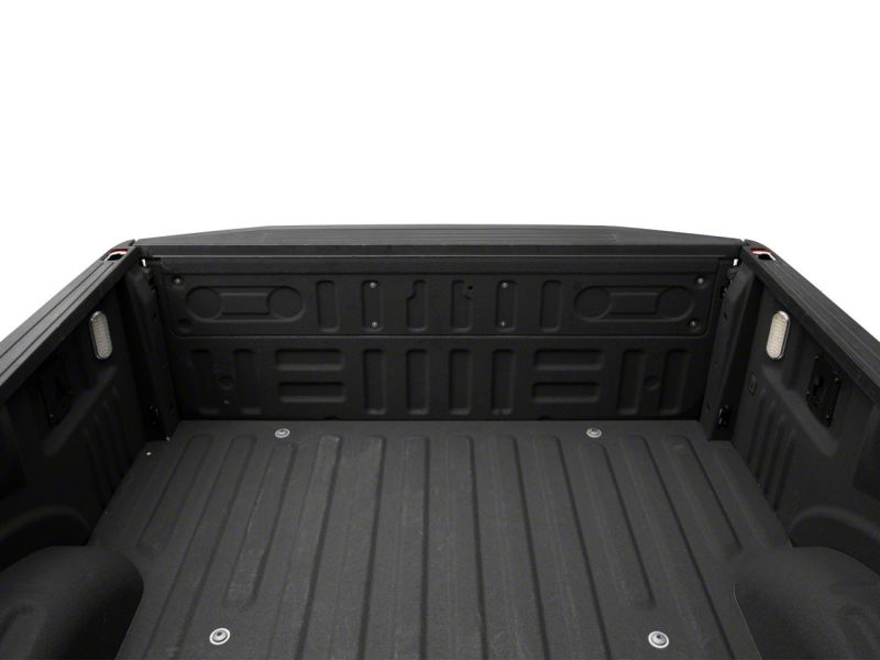 Interior view of a Ford truck bed featuring installed Raxiom Axial Series LED Cargo Lights, demonstrating enhanced visibility from the cargo lights.