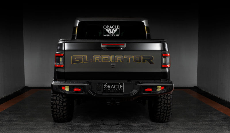 Close-up shot of Jeep Gladiator JT's rear, showcasing ORACLE Lighting's Flush Mount LED Tail Lights in action.