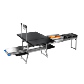 Quick Deploy Ground Kitchen Box by Dirtbox Overland featuring a compact, foldable design with integrated sink, two burners, a cutting board, and built-in table for outdoor cooking convenience.