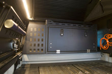 Load image into Gallery viewer, A functional Dirtbox Overland Front Storage Box fitted in a camper interior, demonstrating its versatility for efficient storage during outdoor trips.