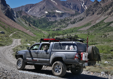 Load image into Gallery viewer, RotopaX 1.75 Gallon Water Container mounted for easy access during camping expeditions.