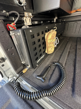 Load image into Gallery viewer, Dirtbox Overland In Bed 15 Gallon Water Tank installed in a truck bed, showcasing the rugged design and integrated pump for off-road enthusiasts.