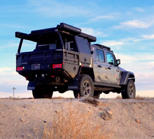 Load image into Gallery viewer, Dirtbox Overland Flatbed System Half Box on a jeep parked on a sunlit ridge, ready for adventure with aesthetic design elements.