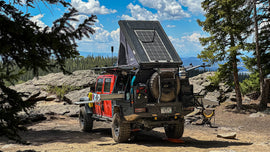 Dirtbox Overland Flatbed System Full Box mounted on a truck in a scenic outdoor setting, showcasing its rugged design and adventure-ready features.