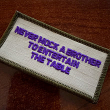 Load image into Gallery viewer, As Seen on Socials - Never Mock A Brother To Entertain The Table - 2x4 Patch - Desert Tan w/Purple